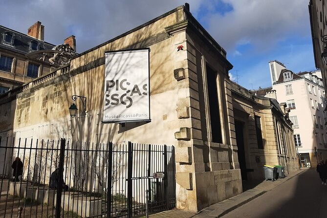 The Musée Picasso's banner on the stone wall of the townhouse that houses it
